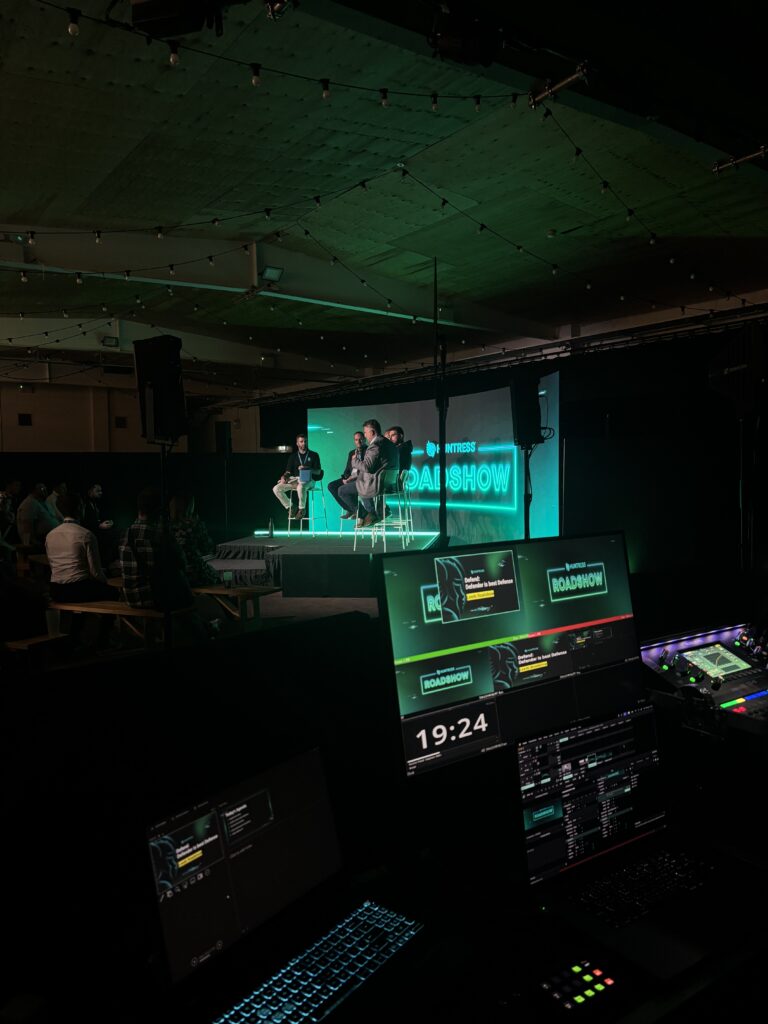 Live event setup for Huntress Roadshow with Fresh team managing event production 